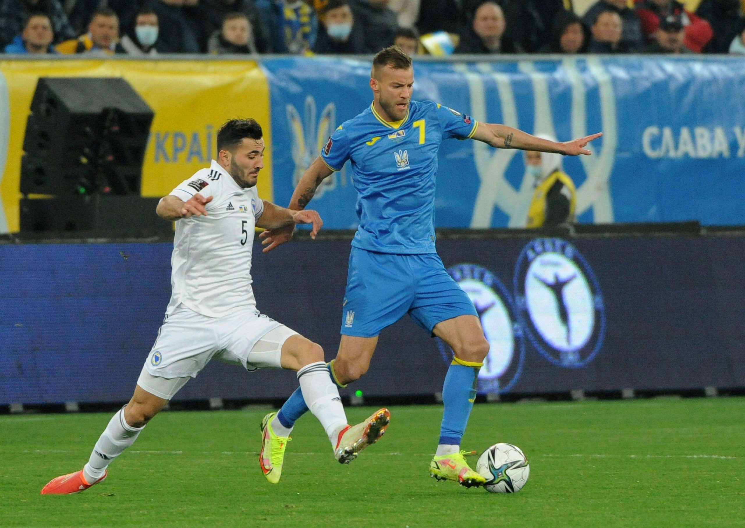 Lviv, Ukraine. 12th Oct, 2021. Andriy Yarmolenko (right) of Ukraine, and Sead Kolasinac (left) of Bosnia and Herzegovina seen in action during the FIFA World Cup Qatar 2022 qualification Group D football match between Ukraine vs Bosnia and Herzegovina at