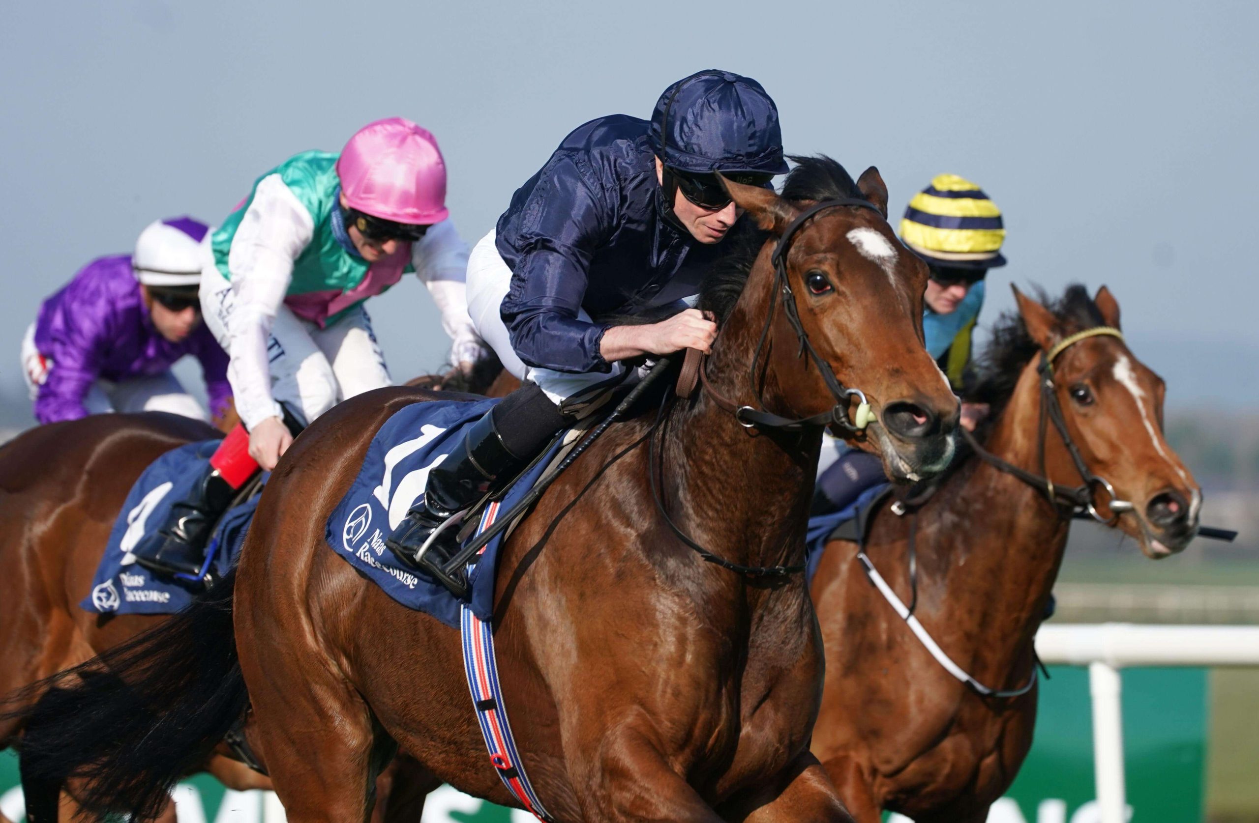 Tuesday ridden by Ryan Moore (centre) on their way to winning the Irish Stallion Farms EBF Fillies Maiden at Naas racecourse. Picture date: Sunday March 27, 2022.
