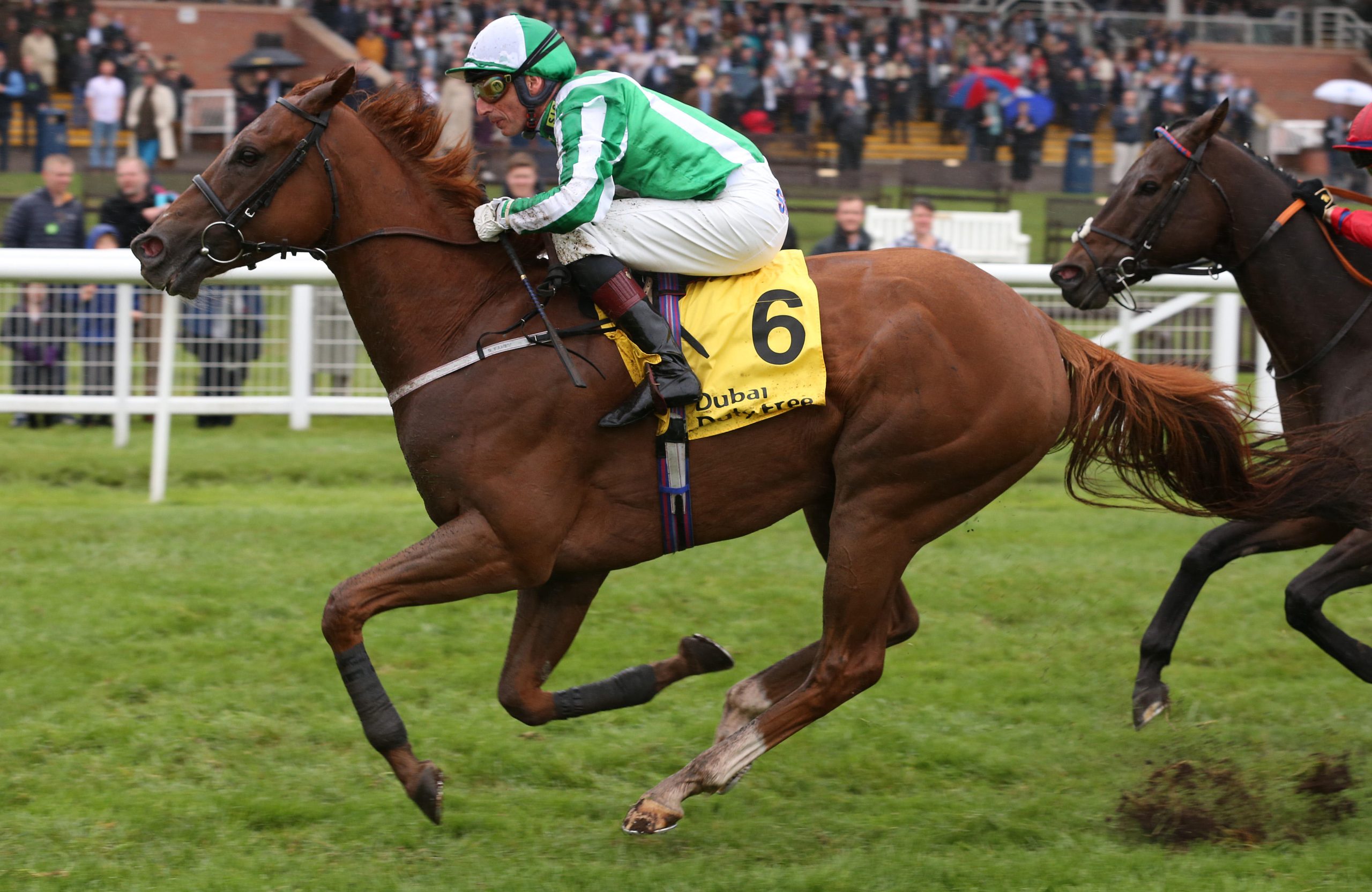 Mr Lupton and Gerald Mosse win The Dubai International Airport World Trophy Stakes Race run during day two of Dubai Duty Free International Weekend at Newbury Racecourse.