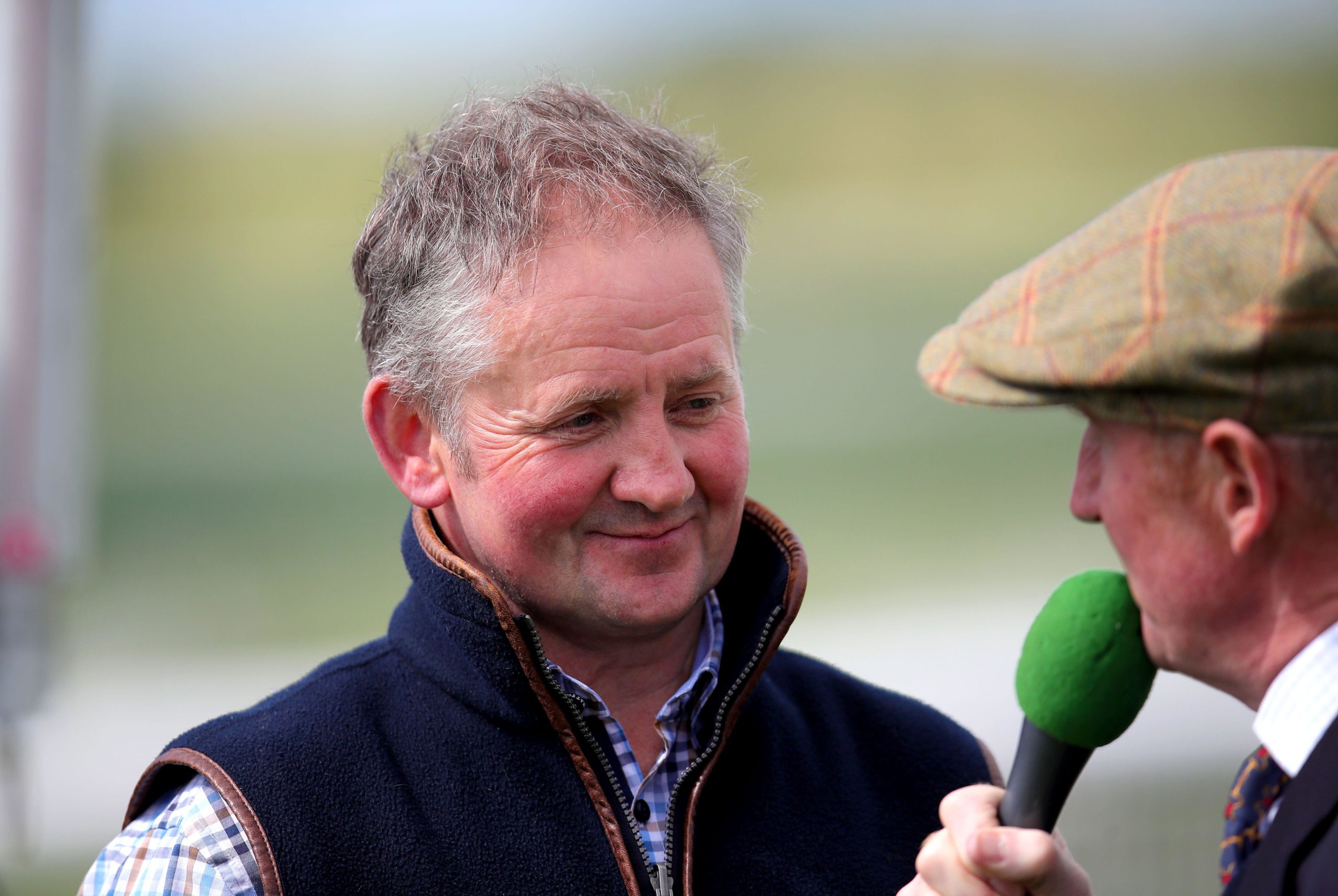 Trainer Gary Hanmer is interviewed after Daranova ridden by jockey Kevin Brogan wins the Stella Artois Handicap Chase at Bangor-On-Dee racecourse, Wrexham County Borough. Picture date: Tuesday May 24, 2022.